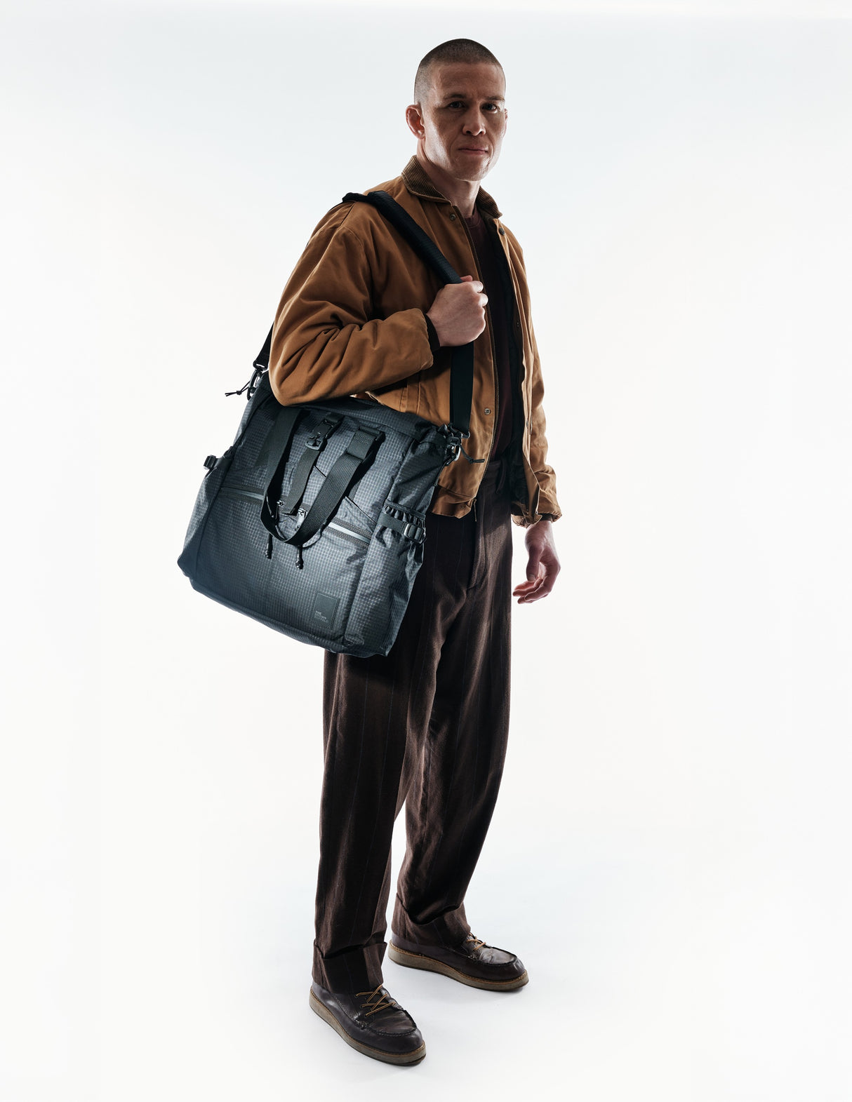 the-brown-buffalo-conceal-tote-edc-laptop-bag-weather-resistant-everyday-use-challenge-ultra-black-grid3_53e7b44e-04d8-44c8-916b-1956b5b464cd_edited.jpg