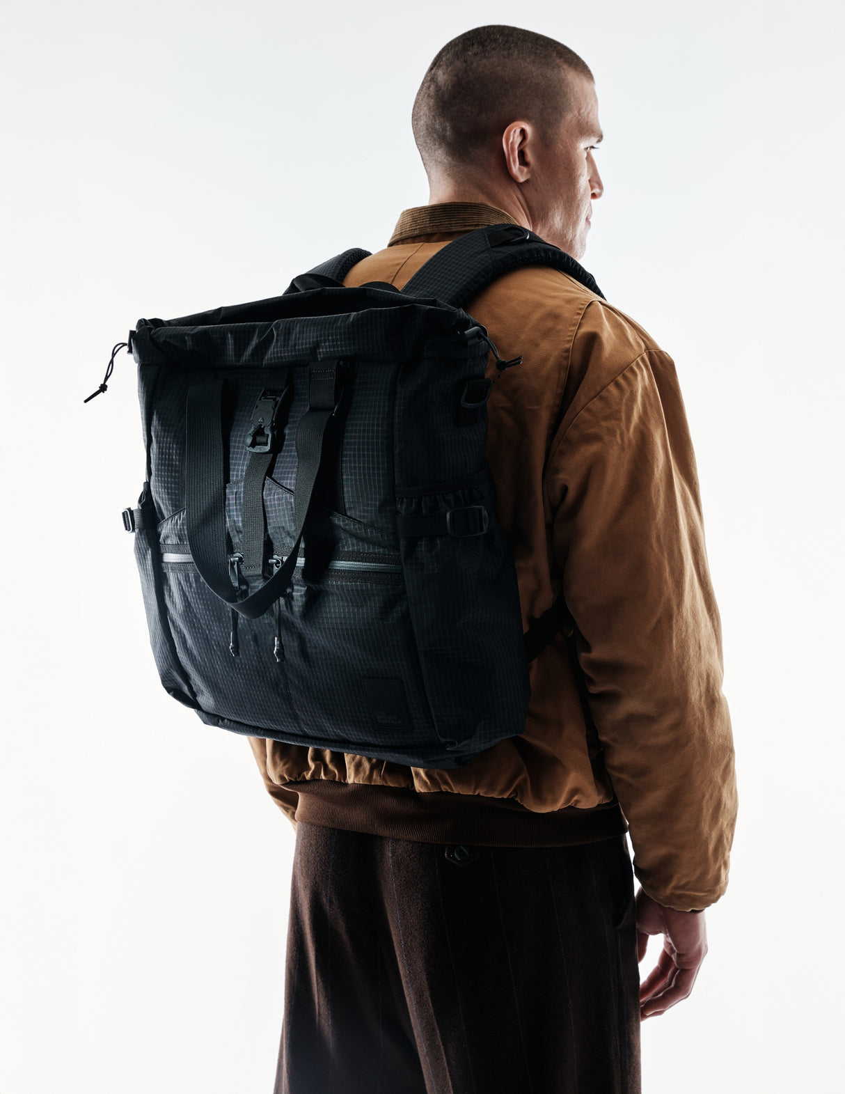 the-brown-buffalo-conceal-tote-edc-laptop-bag-weather-resistant-everyday-use-challenge-ultra-black-grid1_fc9d1d1b-3b81-4fdd-8ece-1b4bb6ac5956_edited.jpg