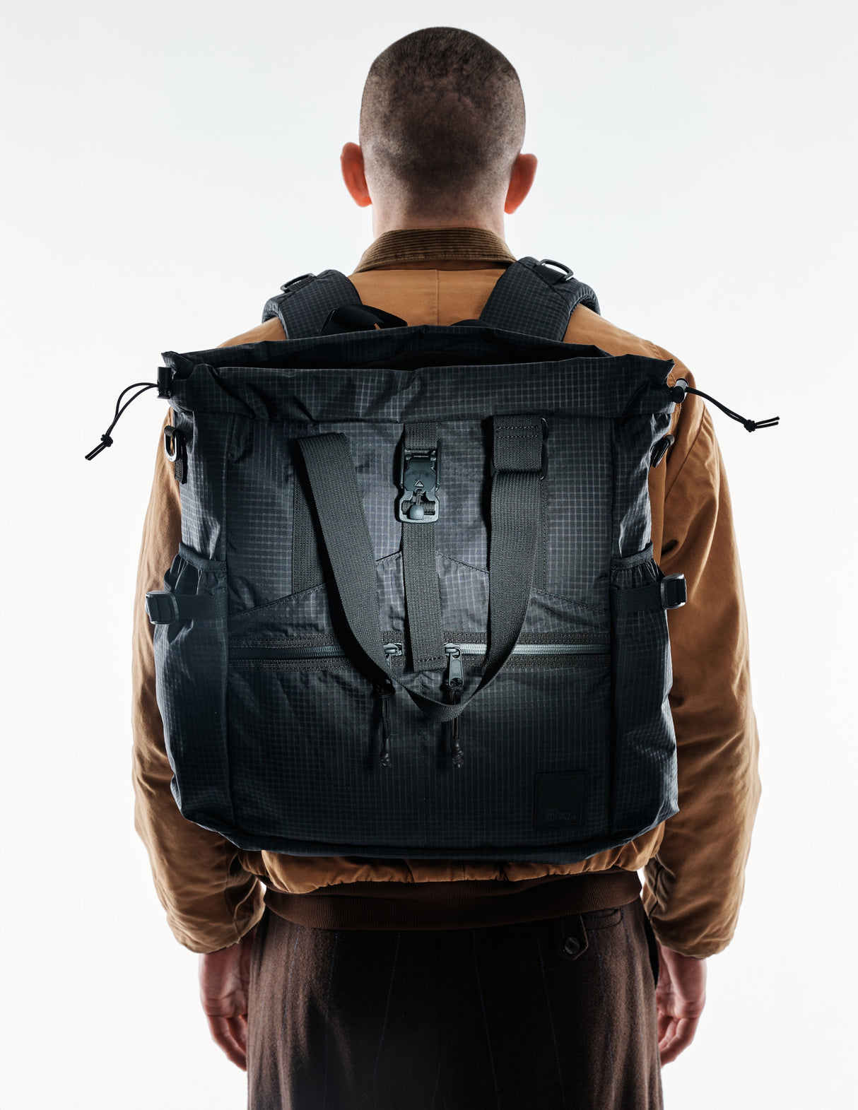 the-brown-buffalo-conceal-tote-edc-laptop-bag-weather-resistant-everyday-use-challenge-ultra-black-grid2_ef5cdd94-fc19-4f3c-bd1f-cc7545cf150c_edited.jpg