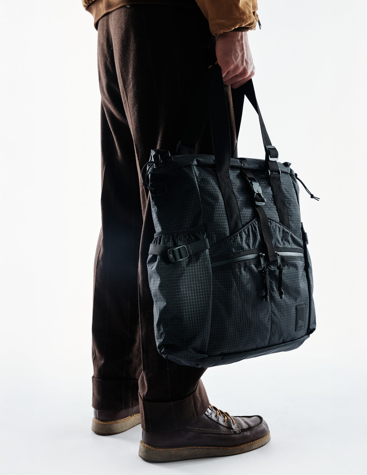 the-brown-buffalo-conceal-tote-edc-laptop-bag-weather-resistant-everyday-use-challenge-ultra-black-grid_9d64d2cf-052b-4dff-8ec5-a5c89fb36d7a_edited.jpg